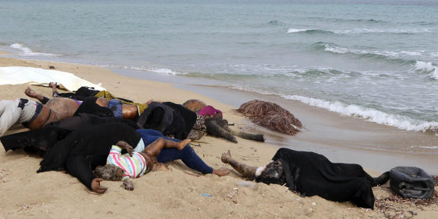 EDITORS NOTE: Graphic content / The bodies of illegal migrants are seen lying on the beach in Garabulli, east of the capital Tripoli, on October 6, 2016 after their boat capsized off the shore of Libya.
With its 1,770 kilometres (1,100 miles) of coastline, Libya has become a hub for illegal migration towards Europe, lacking proper border controls in a country plunged into chaos.
/ AFP / MAHMUD TURKIA (Photo credit should read MAHMUD TURKIA/AFP/Getty Images)