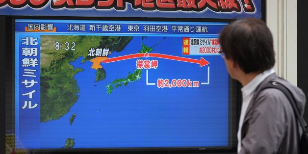 A pedestrian looks at a television screen displaying a map of Japan (R) and the Korean Peninsula in Tokyo on September 15, 2017, following a North Korean missile test that passed over Japan.North Korea fired an intermediate range ballistic missile eastwards over Japan and into the Pacific on September 15, the US said, its latest provocation amid high tensions over its banned weapons programmes. / AFP PHOTO / Kazuhiro NOGI (Photo credit should read KAZUHIRO NOGI/AFP/Getty Images)