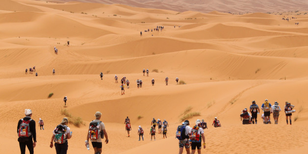 Competitors cross the dunes of Merzouga, the hightest of Morocco , some 300 kms south of Ouarzazate, during the 26th edition of the 'Marathon des Sables' (The Desert Marathon), on April 3, 2011. The 844 self-food sufficient participants walk 250 kms during seven days in the Moroccan Sahara. AFP PHOTO PIERRE VERDY (Photo credit should read PIERRE VERDY/AFP/Getty Images)