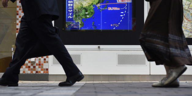 Pedestrians walk past a television screen displaying a map of Japan and the Korean Peninsula in a news program reporting on North Korea's missile launch in Tokyo, Japan, on Friday, Sept. 15, 2017. North Korea fired its second missile over Japan in as many months, a fresh provocation that comes shortly after the United Nations approved harsher sanctions against Kim Jong Uns regime. Photographer: Akio Kon/Bloomberg via Getty Images
