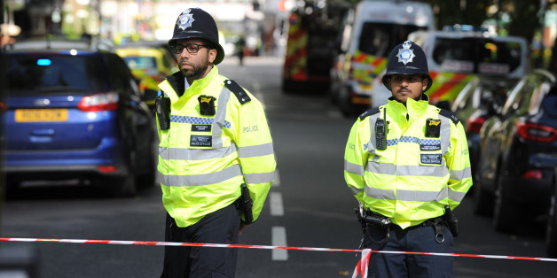 FULHAM, LONDON, GREATER LONDON, UNITED KINGDOM - 2017/09/15: Policemen stands around the Parsons Green Underground Station.Several injured at Parsons Green as passengers report seeing device on District Line tube train during morning rush-hour.A large police deployment is guarding the access to the station. The nearest houses to the station have been evacuated until the zone is safe. The police warms more explosives. (Photo by Gustavo Valiente/SOPA Images/LightRocket via Getty Images)
