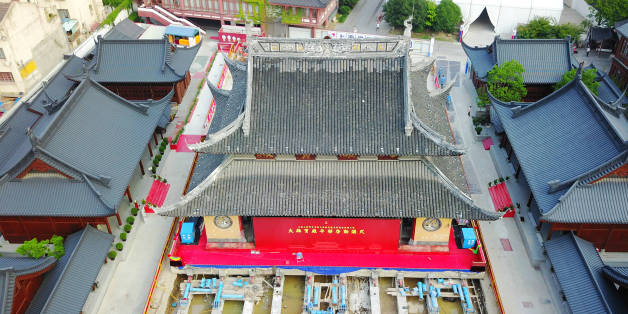 SHANGHAI, CHINA - SEPTEMBER 06: Aerial view of the main hall of Jade Buddha Temple (aka Yufo Temple) moved horizontally on September 6, 2017 in Shanghai, China. The main hall of Shanghai's Jade Buddha Temple will be entirely moved over 30 meters horizontally and more than 1 meter higher in order to enlarge the space between the halls and ensure the safety of wooden buildings. (Photo by VCG/VCG via Getty Images)