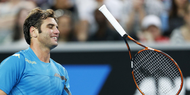 Malek Jaziri of Tunisia throws his racquet during his men's singles third round match against Nick Kyrgios of Australia at the Australian Open 2015 tennis tournament in Melbourne January 23, 2015. REUTERS/Athit Perawongmetha (AUSTRALIA - Tags: SPORT TENNIS)
