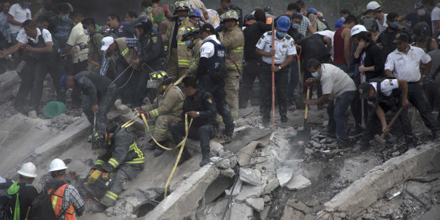 MEXICO CITY, MEXICO - SEPTEMBER 19: Rescuers and residents look for victims amid the ruins of a building knocked down by a magnitude 7.1 earthquake that jolted central Mexico damaging buildings, knocking out power and causing alarm throughout the capital on September 19, 2017 in Mexico City, Mexico. The earthquake comes 32 years after a magnitude-8.0 earthquake hit on September 19, 1985. (Photo by Christian Palma/Getty Images)