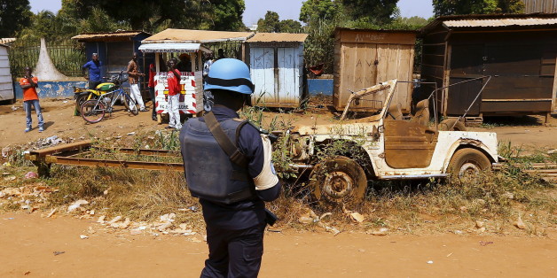 A United Nations peacekeeper stands alongside a road before Pope Francis' visit to the refugee camp of Saint Sauveur, in the capital Bangui, November 29, 2015. REUTERS/Stefano Rellandini