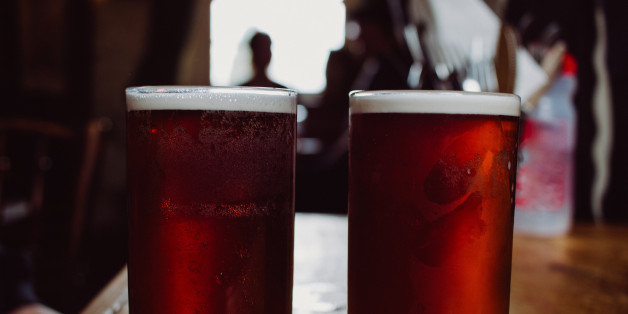 An english ale bitter beer pint on a wooden table in a pub in UK