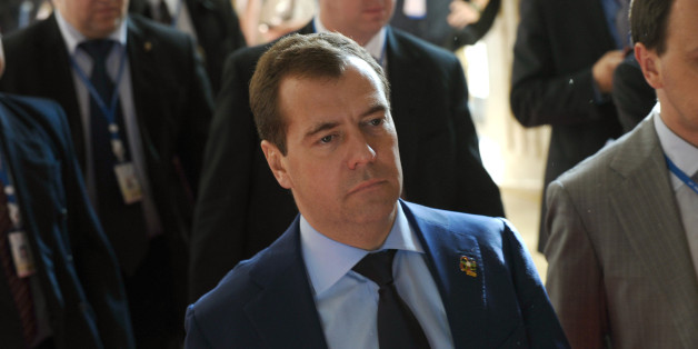 Russian Prime Minister Dmitri Medvedev (C) walks at the venue of the ninth Asia-Europe (ASEM 9) summit in Vientiane on November 6, 2012. The two-day bi-annual summit is being held in the capital of the Southeast Asian landlocked communist nation between November 5-6. AFP PHOTO / HOANG DINH Nam (Photo credit should read HOANG DINH NAM/AFP/Getty Images)