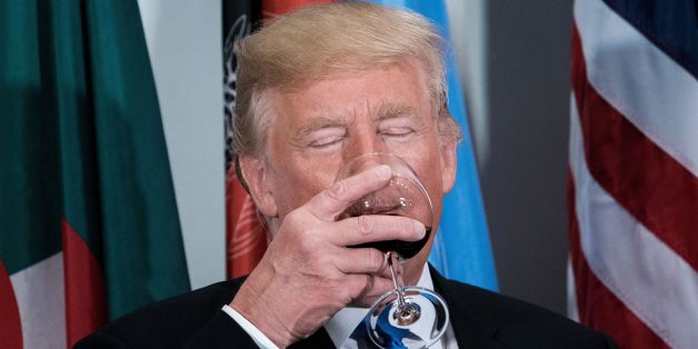 US President Donald Trump sips a glass after making a toast during a luncheon at the United Nations headquarters during the 72nd session of the United Nations General Assembly September 19, 2017 in New York. / AFP PHOTO / Brendan Smialowski (Photo credit should read BRENDAN SMIALOWSKI/AFP/Getty Images)