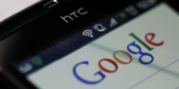 The Google Inc. company logo is seen on an HTC Touch HD smartphone in this arranged photograph in London, U.K., on Wednesday, Aug. 29, 2012. Google Inc. previewed features designed for businesses using its Google+ social service, stepping up competition with LinkedIn Corp., operator of the biggest professional networking site. Photographer: Chris Ratcliffe/Bloomberg via Getty Images