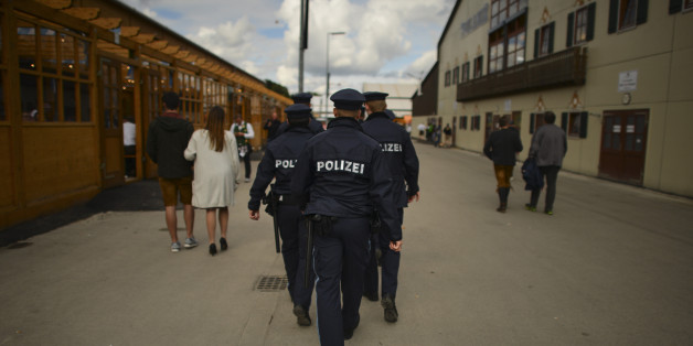 MUNICH, GERMANY - SEPTEMBER 17: A group of policemen patrols the fairground on the second day of the 2017 Oktoberfest beer fest on September 17, 2017 in Munich, Germany. Oktoberfest is the world's largest beer celebration and typically draws over six million visitors over its three-week run. Oktoberfest includes massive beer tents, each run by a different Bavarian brewer, as well as amusement rides and activities. (Photo by Philipp Guelland/Getty Images)