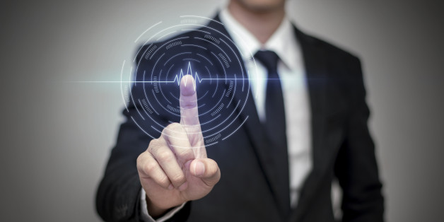 Close up of businessman touching digital screen with fingerClose up of businessman touching digital screen with finger