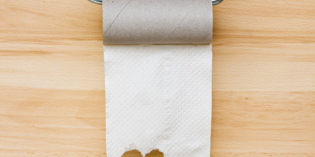 Toilet paper on wooden background. Empty space for text