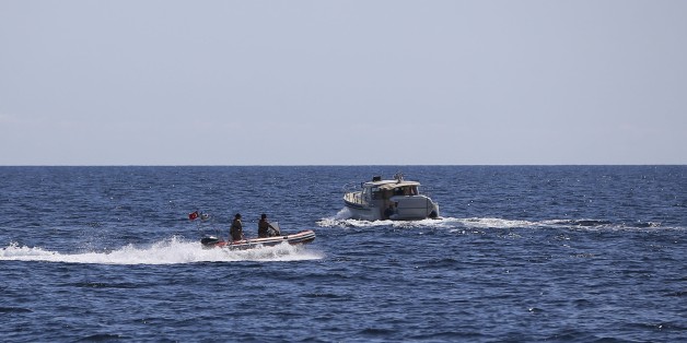 ISTANBUL, TURKEY - SEPTEMBER 15: Members of Turkish Coast Guard Command approach to inspect a boat to prevent irregular migration and illegal transition at Black Sea in Istanbul, Turkey on September 15, 2017. (Photo by Emrah Yorulmaz/Anadolu Agency/Getty Images)