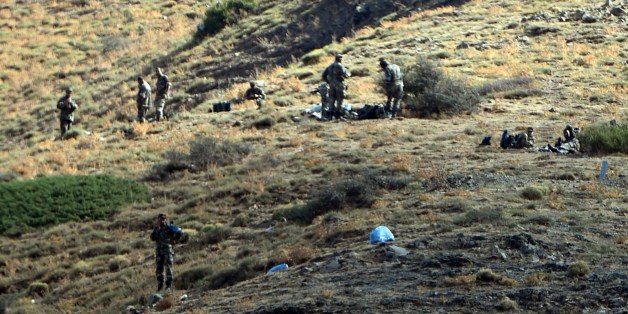 Algerian army troops carry out search operations in the mountainous eastern Tizi Ouzou region in a desperate bid to find French hiker Herve Gourdel who was kidnapped by militants linked to the Islamic State group who have threatened to execute him on September 23, 2014 near the village of Ait Ouaban, 80 km south of Tizi Ouzou. Paris vowed it would not negotiate with jihadists, as the local army raced against time to find him before his threatened execution. AFP PHOTO / FAROUK BATICHE (P