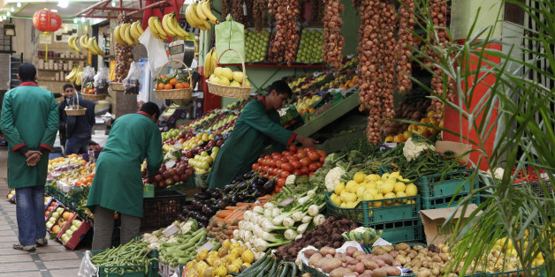 Vendors sell fruits and vegetables at a market in Rabat January 15, 2013. The alleys of Rabat's old city resound with the shouts of street vendors advertising Chinese consumer goods such as fabrics and electronic gadgets. But the area's vegetable sellers, from whom many residents buy dinner on the way home, are unusually quiet. Morocco's cash-strapped government is preparing to launch its biggest economic policy change in years: root-and-branch reform of the system of food and energy subsidies w