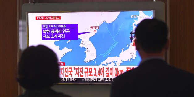 People watch a television news screen showing a map of the epicenter of an earthquake in North Korea, at a railway station in Seoul on September 23, 2017.
China's seismic service CENC on September 23 detected a zero-depth, 3.4-magnitude earthquake in North Korea, calling it a 'suspected explosion'. There seemed to be some initial difference of opinion, however, with Seoul's Korea Meteorological Agency (KMA) saying that it had registered a tremor of a similar size, but judged it a 'natural quake'. / AFP PHOTO / JUNG Yeon-Je (Photo credit should read JUNG YEON-JE/AFP/Getty Images)