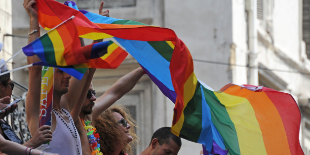 People take part in the gays, lesbians, bisexuals and supporters of equal rights for sexual minorities march, the Europride parade, at the Vieux Port on July 20, 2013 in Marseille, southern France. AFP PHOTO / ANNE-CHRISTINE POUJOULAT (Photo credit should read ANNE-CHRISTINE POUJOULAT/AFP/Getty Images)