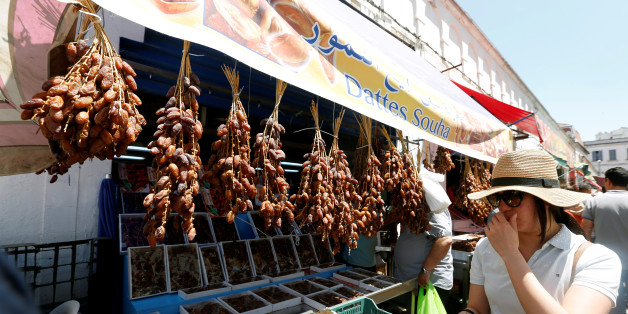 A women looks at dates on the first day of the holy fasting month of Ramadan at a market in Tunis, Tunisia, May 27, 2017. REUTERS/Zoubeir Souissi