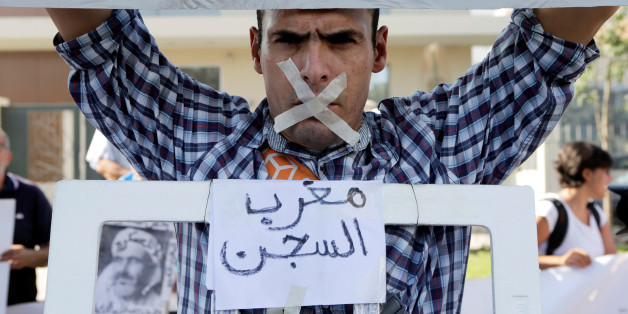A relative of the leaders of Morocco's Hirak protest movement displays a placard that reads "Moroccan jail" during the trial outside the court in Casablanca, Morocco September 12, 2017. REUTERS/Youssef Boudlal