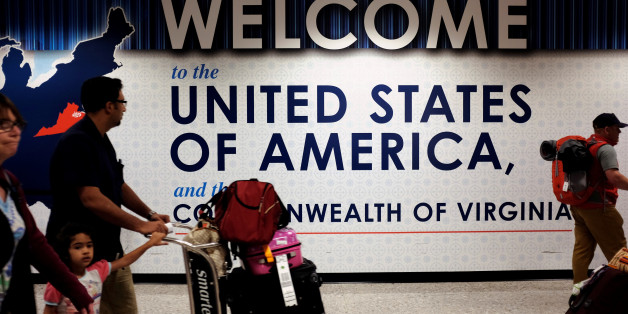 A family exits after clearing immigration and customs at Dulles International Airport in Dulles, Virginia, U.S. September 24, 2017. REUTERS/James Lawler Duggan