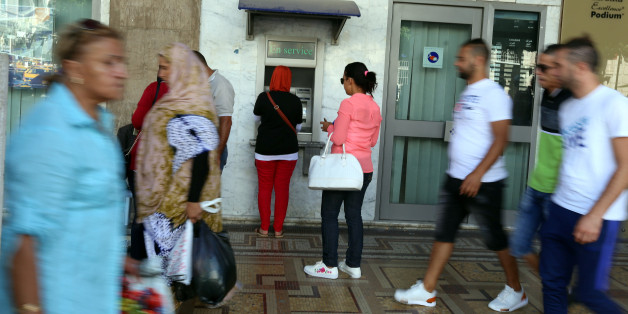 A woman uses a cash machine in downtown Tunis, Tunisia, September 21, 2017 REUTERS/Zoubeir Souissi