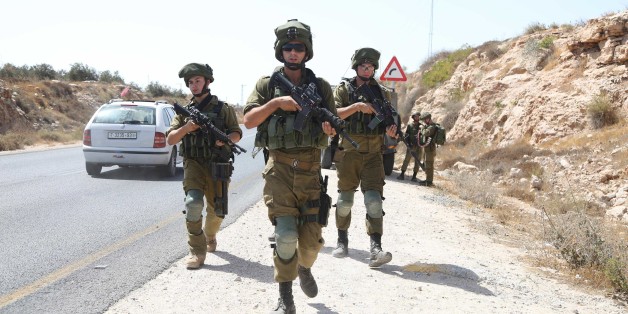 HEBRON, WEST BANK - SEPTEMBER 22: Israeli security forces take security measures during Palestinian's protest due to Israeli authorities' blockage of a village's road in Hebron, West Bank on September 22, 2017. (Photo by Issam Rimawi/Anadolu Agency/Getty Images)