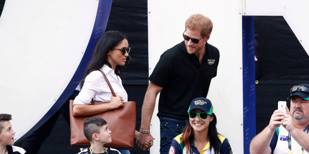 Britain's Prince Harry (R) arrives with girlfriend actress Meghan Markle at the wheelchair tennis event during the Invictus Games in Toronto, Ontario, Canada September 25, 2017. REUTERS/Mark Blinch