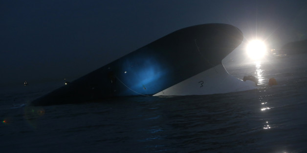 South Korean ferry "Sewol" is seen sinking at the sea off Jindo April 16, 2014. Almost 300 people were missing after a ferry capsized off South Korea on Wednesday, despite frantic rescue efforts involving coastguard vessels, fishing boats and helicopters, in what could be the country's biggest maritime disaster in over 20 years. REUTERS/Kim Hong-Ji (SOUTH KOREA - Tags: DISASTER MARITIME)