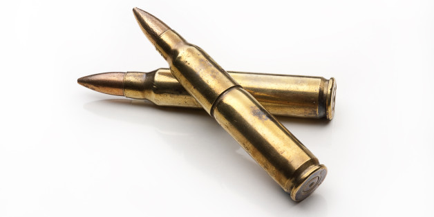 Old rifle cartridges isolated on white background.