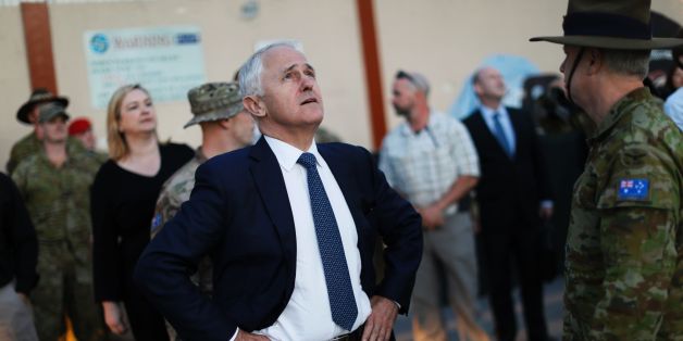Australia's Prime Minister Malcolm Turnbull looks at an helicopter passing overhead at Resolute Support headquarters in Kabul, on April 24, 2017, ahead of a meeting with US Defence Secretary.
US Defense Secretary Jim Mattis arrived in Afghanistan on an unannounced visit April 24, an American defence official confirmed, hours after his Afghan counterpart resigned over a deadly Taliban attack. Mattis, making his first visit to Afghanistan as Pentagon chief, was due to meet top officials including President Ashraf Ghani less than two weeks after the US dropped its largest non-nuclear bomb on Islamic State hideouts in the country's east. / AFP PHOTO / POOL / JONATHAN ERNST (Photo credit should read JONATHAN ERNST/AFP/Getty Images)