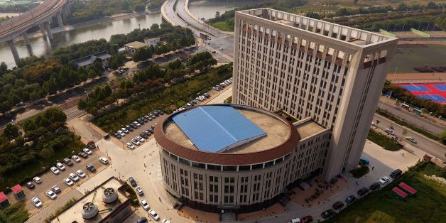 This photo taken on September 21, 2017 shows an aerial view of the buliding of the Career and Entrepreneurship Comprehensive Service Base of University Graduates in Zhengzhou in China's central Henan province. China has another entry when it comes to buildings that look suspiciously like something else -- a 12-storey block at a university strongly resembling a giant toilet. / AFP PHOTO / STR / China OUT (Photo credit should read STR/AFP/Getty Images)