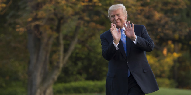 US President Donald Trump walks from Marine One after arriving on the South Lawn of the White House in Washington, DC, September 27, 2017, after traveling to Indiana to unveil his tax reform plan. / AFP PHOTO / SAUL LOEB (Photo credit should read SAUL LOEB/AFP/Getty Images)