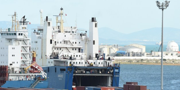 A cargo ship unloads imported goods in the Tunisian port city of Rades on November 12, 2014. The World Bank said in a report published last September that Tunisia's economic model of manufacturing for exports and protecting the domestic market was valid in the 1970s but since then had hindered progress. AFP PHOTO / FETHI BELAID (Photo credit should read FETHI BELAID/AFP/Getty Images)