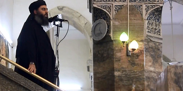 MOSUL, IRAQ - JULY 5 : An image grab taken from a video released on July 5, 2014 by Al-Furqan Media shows alleged Islamic State of Iraq and the Levant (ISIL) leader Abu Bakr al-Baghdadi preaching during Friday prayer at a mosque in Mosul.(Photo by Al-Furqan Media/Anadolu Agency/Getty Images)