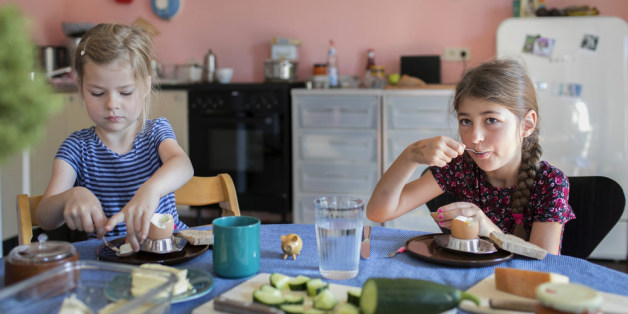 Bonn, Germany - August 07: A five and a seven-year-old girl are having breakfast together and eat boiled eggs on August 07, 2017 in Bonn, Germany. (Photo by Ute Grabowsky/Photothek via Getty Images)