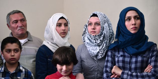 Members of a Syrian refugee family, wait for a visit of UN high commissioner for refugees, in an apartment where they live in Athens, rented to them by the United Nations High Commissioner for Refugees (UNHCR), on August 24, 2016.
Samar, who fled Aleppo in Syria, lives in the apartment with her four children and her parents, Mohammad and Fatima, is waiting to be reunited with her husband who is currently elsewhere in Europe. More than 58,000 refugees and migrants are stranded in Greece with most of them living in refugee camps, while some 8,000 live in UNHCR arranged shelters, houses or hotels. / AFP / LOUISA GOULIAMAKI (Photo credit should read LOUISA GOULIAMAKI/AFP/Getty Images)