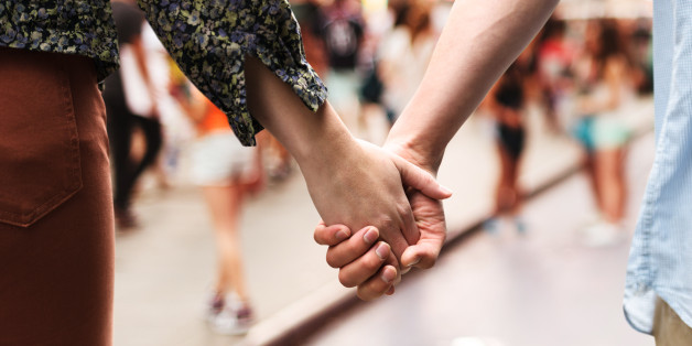 Holding hands, caucasian couple in love