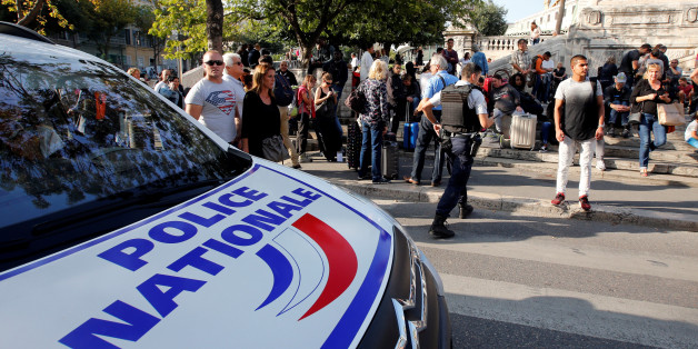 Travellers gather as at police secure the access to the Saint-Charles train station after French soldiers shot and killed a man who stabbed two women to death at the main train station in Marseille, France, October 1, 2017. REUTERS/Jean-Paul Pelissier