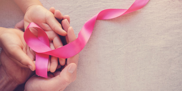 Adult and child hands holding pink ribbons, Breast cancer awareness, abdominal cancer awareness and October Pink panoramic background