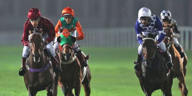 Female Qatari jockey Maryam Al-Subaiey (L) participates in a horse race at the Racing and Equestrian Club in the capital Doha on February 24, 2017.Maryam al-Subaiey who created ripples by appearing on television without a headscarf has broken new ground as a jockey in the conservative Gulf country, where men usually hold the reins. / AFP PHOTO / KARIM JAAFAR (Photo credit should read KARIM JAAFAR/AFP/Getty Images)
