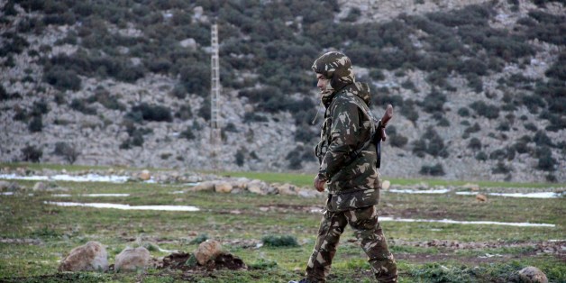An Algerian soldier takes part in a rescue operation after an C-130 Hercules aircraft crashed into Mount Fertas in the Oum El Bouaghi region, about 500 km from the capital Algiers, on February 11, 2014. A military aircraft carrying 78 people crashed in Algeria's mountainous northeast with just one survivor, in one of the country's deadliest air disasters, the defence ministry said. AFP PHOTO / STR (Photo credit should read -/AFP/Getty Images)
