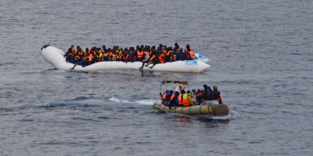 Migrants sit in their boat during a rescue operation of 219 migrants by Italian naval vessel Bettica (not seen) in this February 23, 2016 handout picture provided by Marina Militare. More than 700 migrants were rescued from six leaky boats in the sea between Tunisia and Sicily on Tuesday and four were found dead, the Italian navy said. REUTERS/Marina Militare/Handout via Reuters ATTENTION EDITORS - THIS PICTURE WAS PROVIDED BY A THIRD PARTY. REUTERS IS UNABLE TO INDEPENDENTLY VERIFY THE AUTHENTICITY, CONTENT, LOCATION OR DATE OF THIS IMAGE. FOR EDITORIAL USE ONLY. NOT FOR SALE FOR MARKETING OR ADVERTISING CAMPAIGNS. THIS PICTURE IS DISTRIBUTED EXACTLY AS RECEIVED BY REUTERS, AS A SERVICE TO CLIENTS.