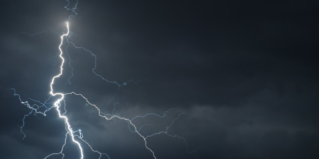 Fork lightning striking down during summer storm.