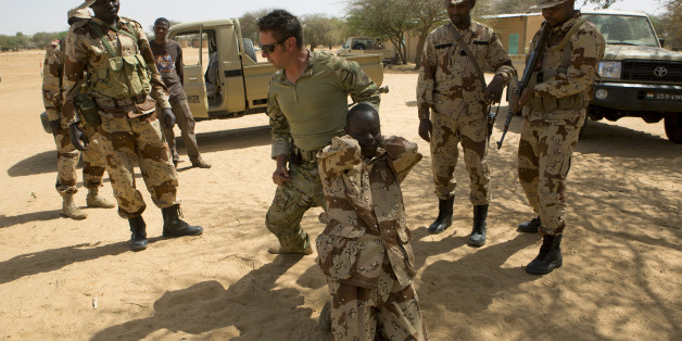 A U.S. special forces soldier demonstrates how to detain a suspect during Flintlock 2014, a U.S.-led international training mission for African militaries, in Diffa, March 4, 2014. On a dusty training ground in Niger, U.S. Special Forces teach local troops to deal with suspects who resist arrest. The drill in the border town of Diffa is part of Operation Flintlock, a counter-terrorism exercise for nations on the Sahara's southern flanks that the United States organises each year. Washington's ai