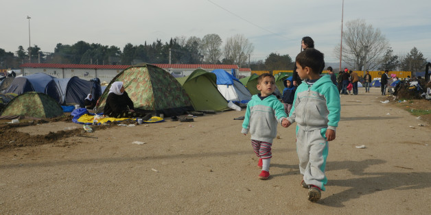 Idomeni, Greece - March 6, 2016: Refugee children are seen at the makeshift refugee camp in Idomeni, near the Greece-Macedonian border.