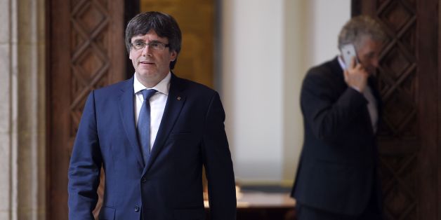 Catalan president Carles Puigdemont arrives to receive members of the Independent Commission for Mediation, Dialogue and Conciliation at the Catalan Government 'Generalitat' headquarters in Barcelona on October 6, 2017.The Catalan regional government has said it could declare independence next week. It claims voters backed the move in a referendum vote outlawed by Madrid. The political standoff has dragged Spain into its worst political crisis in decades. Catalonia accounts for a fifth of Spain'
