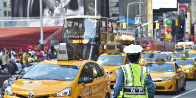 A police officer controls the traffic in Times Square, downtown Manhattan, on July 1, 2017 in New York City. / AFP PHOTO / LOIC VENANCE (Photo credit should read LOIC VENANCE/AFP/Getty Images)