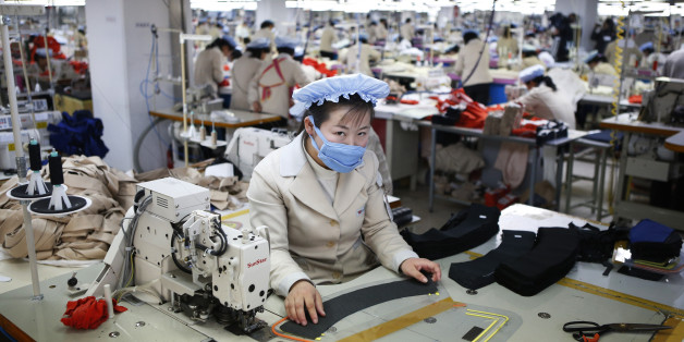 A North Korean employee works in a factory of a South Korean company at the Joint Industrial Park in Kaesong industrial zone, a few miles inside North Korea from the heavily fortified border December 19, 2013. Kaesong, with investors from South Korea, was a rare source of hard currency for North Korea. It was established even though North Korea is technically still at war with South Korea, one of the world's richest countries, since the 1950-53 Korean War ended not in a treaty but a truce. Since