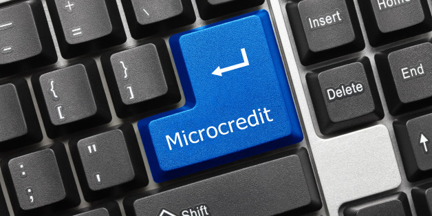 Close-up view on conceptual keyboard - Microcredit (blue key)