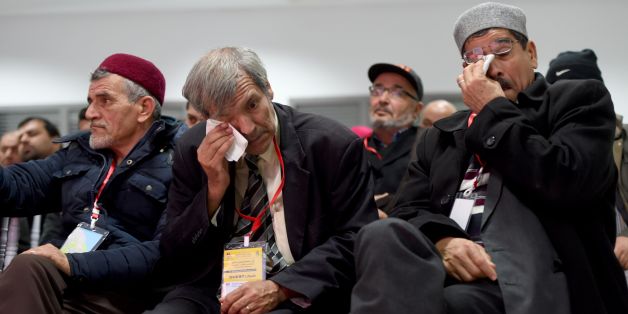 Men wipe their tears as relatives of abuse victims watch a live broadcast of testimonials by abuse victims before the Truth and Dignity Commission in Tunis on December 16, 2016.
Victims of murder, rape and torture under successive dictatorships started testifying on live television as Tunisia -- in a rare move for the Arab world -- tries to deal with decades of abuse. The Truth and Dignity Commission (IVD) has tracked human rights violations committed between July 1955, a year before Tunisia gained its independence from France, and December 2013 when the fact-finding body was established. / AFP / FETHI BELAID (Photo credit should read FETHI BELAID/AFP/Getty Images)